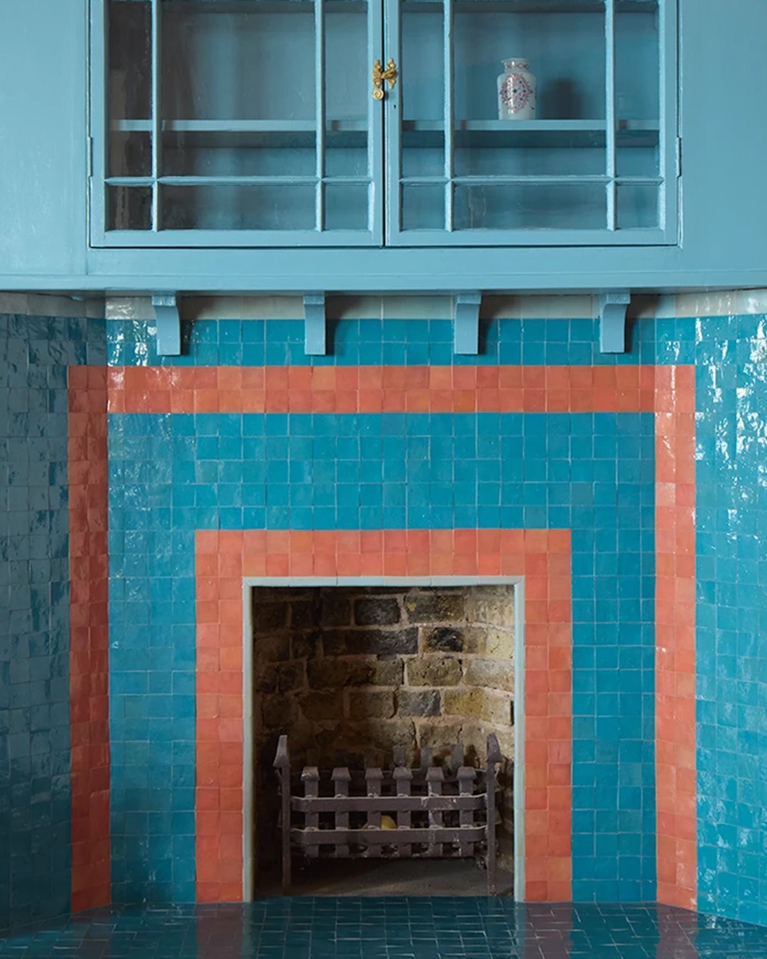 Blue and orange fireplace with small zellige tiles copy